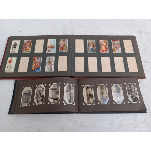 295 - A collection of vintage cigarette card albums to include Wills's Roses, Garden Life, Aviation, Crick... 