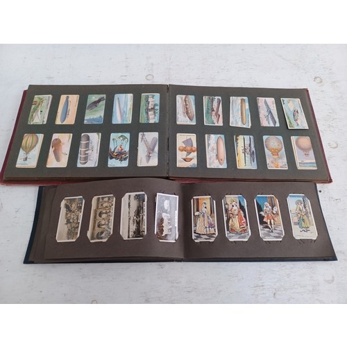 295 - A collection of vintage cigarette card albums to include Wills's Roses, Garden Life, Aviation, Crick... 