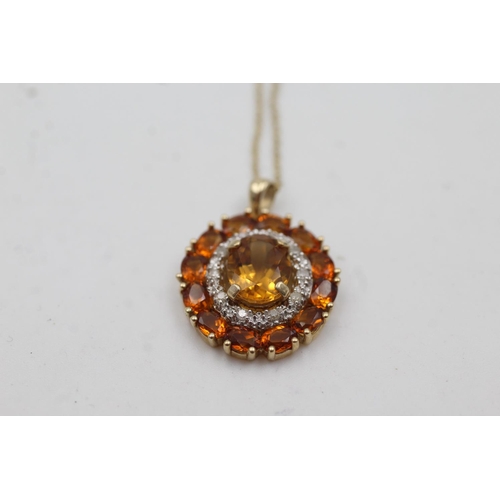 1002 - A 9ct gold citrine and diamond double halo pendant necklace - approx. gross weight 3.3 grams