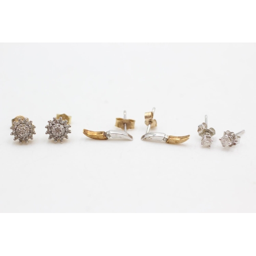 1004 - Three pairs of 9ct gold diamond stud earrings - approx. gross weight 2 grams