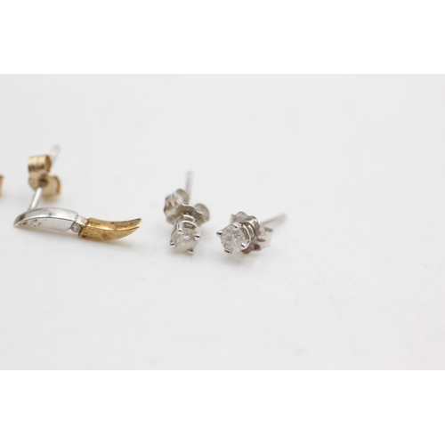 1004 - Three pairs of 9ct gold diamond stud earrings - approx. gross weight 2 grams