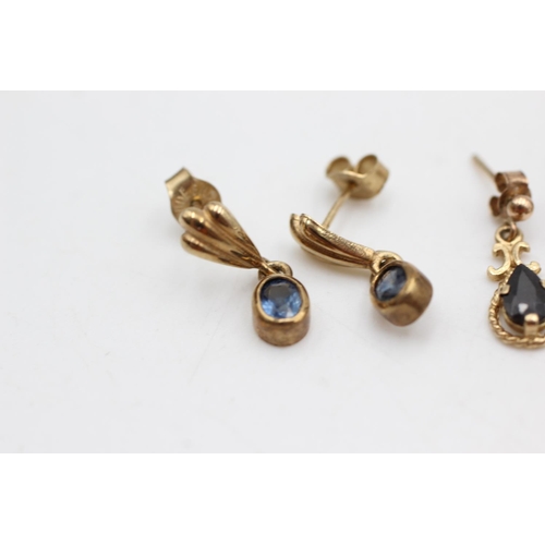 1007 - Two pairs of 9ct gold and sapphire drop earrings - approx. gross weight 2.9 grams