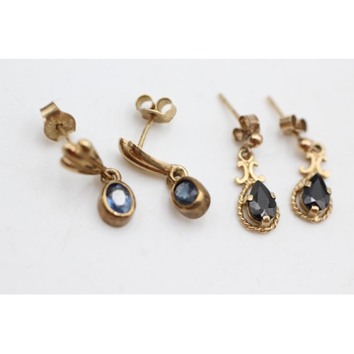 1007 - Two pairs of 9ct gold and sapphire drop earrings - approx. gross weight 2.9 grams