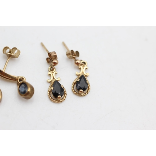 1007 - Two pairs of 9ct gold and sapphire drop earrings - approx. gross weight 2.9 grams