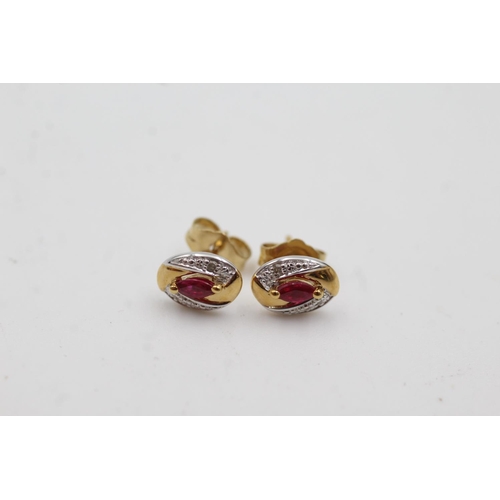 1009 - A pair of 9ct gold ruby and diamond stud earrings - approx. gross weight 0.9 grams