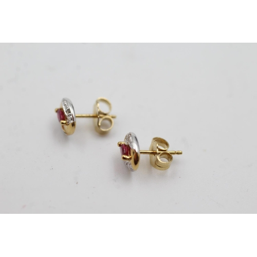 1009 - A pair of 9ct gold ruby and diamond stud earrings - approx. gross weight 0.9 grams