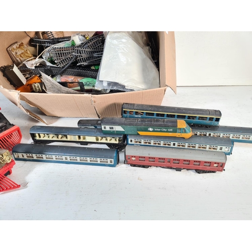 104 - A collection of assorted model railway accessories to include Tri-ang AR29-221 coach, Echo 80150 pla... 