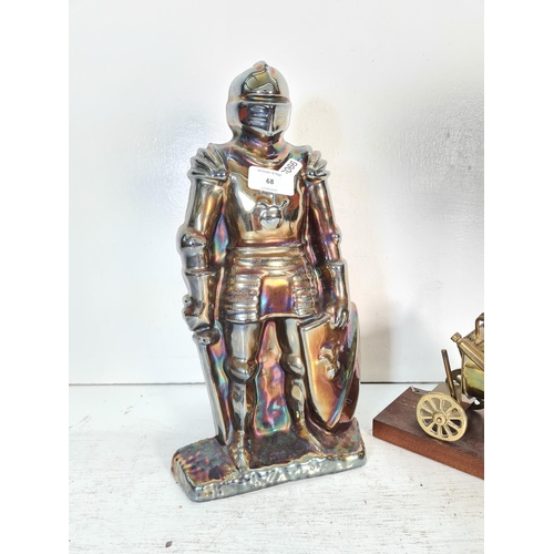 68 - Two items, one cast metal novelty knight companion set and one brass model of Stevenson's Rocket on ... 