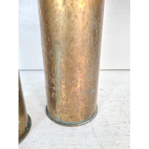 69 - Two brass shell cases, one WWI dated 1917 and one WWII dated 1942 - largest approx. 29cm high