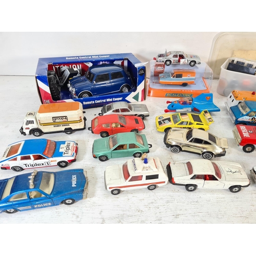 74 - A collection of assorted model vehicles to include Saico Ford Anglia, SCX Ford Fiesta WRC, boxed Sca... 