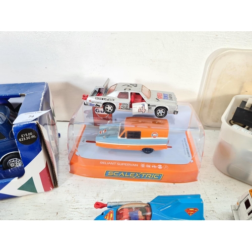 74 - A collection of assorted model vehicles to include Saico Ford Anglia, SCX Ford Fiesta WRC, boxed Sca... 