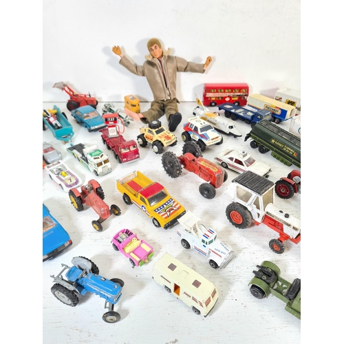 74A - A collection of assorted vintage diecast model vehicles and toys to include Action Man figurine with... 