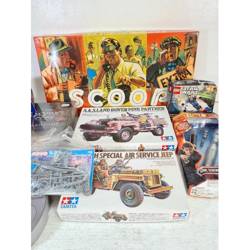 75 - A collection of boxed toys and games to include Tamiya British Special Air Service jeep plastic mode... 