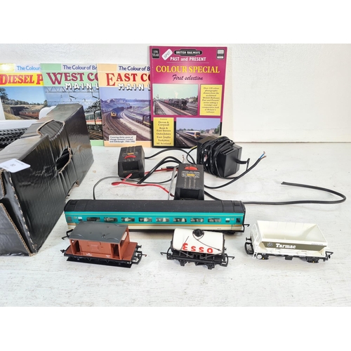 80 - A collection of Hornby plastic OO gauge model railways accessories to include Esso tanker, track, R4... 