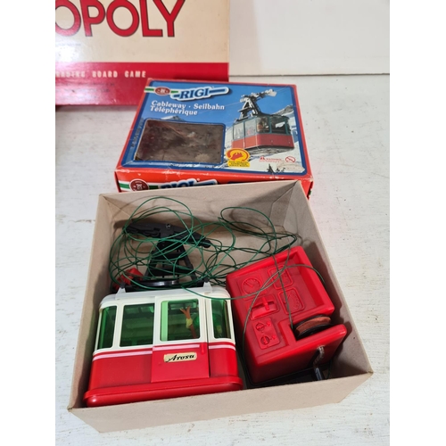 90 - A collection of assorted boxed toys and games to include Monopoly, Chinese chess, Cover Up, Take The... 