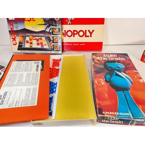 90 - A collection of assorted boxed toys and games to include Monopoly, Chinese chess, Cover Up, Take The... 