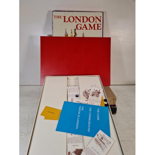 91 - A collection of assorted boxed toys and games to include The Balancing Chairs game, Hangman, Skim-a-... 