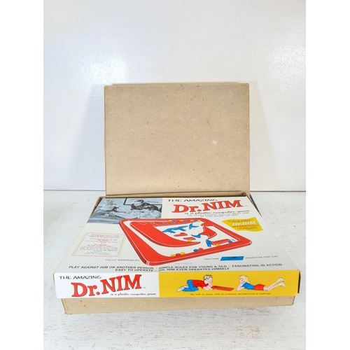 91 - A collection of assorted boxed toys and games to include The Balancing Chairs game, Hangman, Skim-a-... 