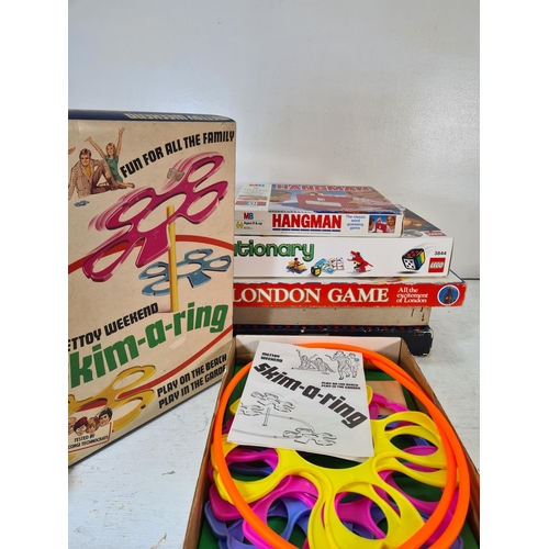 91 - A collection of assorted boxed toys and games to include The Balancing Chairs game, Hangman, Skim-a-... 