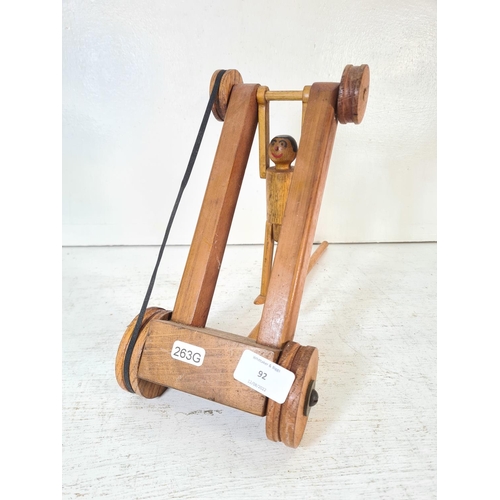 92 - A mid/late 20th century scratch built wooden push along acrobatic toy - approx. 26cm high x 14cm wid... 