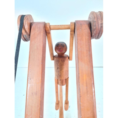 92 - A mid/late 20th century scratch built wooden push along acrobatic toy - approx. 26cm high x 14cm wid... 