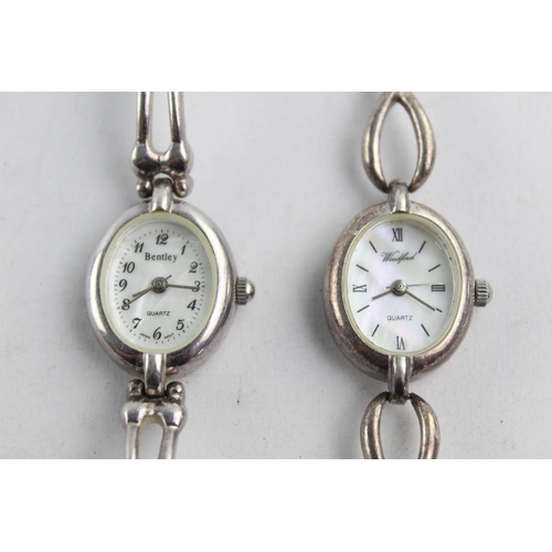 1083 - Two hallmarked sterling silver quartz women's wristwatches with mother of pearl dials, one Woodford ... 