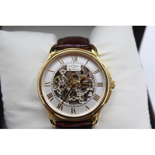 1100 - A boxed Rotary automatic skeleton men's wristwatch with original brown leather strap