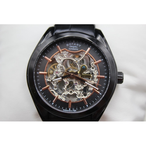 1101 - A boxed Rotary automatic skeleton men's wristwatch with original black leather strap