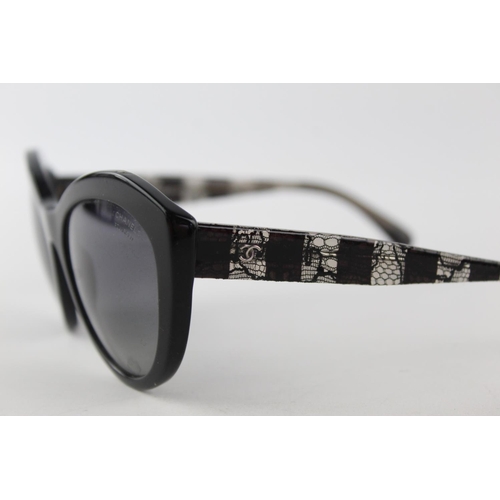 119 - A pair of black Chanel sunglasses with polarized lenses and dust bag