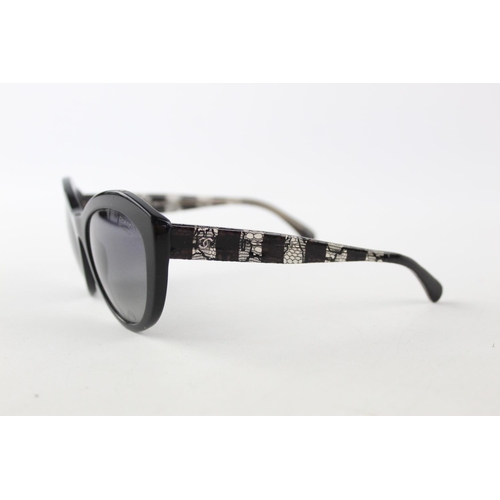 119 - A pair of black Chanel sunglasses with polarized lenses and dust bag