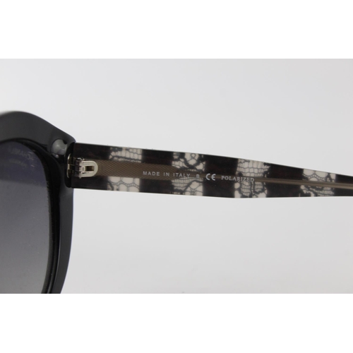 119 - A pair of black Chanel sunglasses with polarized lenses and dust bag