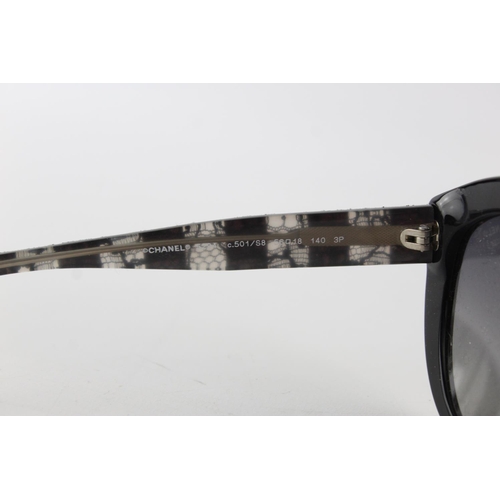 119 - A pair of black Chanel sunglasses with polarized lenses and dust bag