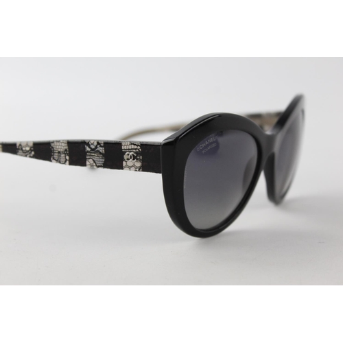 119 - A pair of black Chanel sunglasses with polarized lenses and dust bag