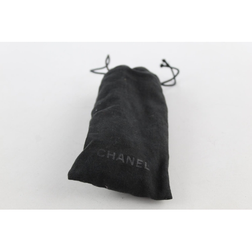 119 - A pair of black Chanel sunglasses with polarized lenses and dust bag