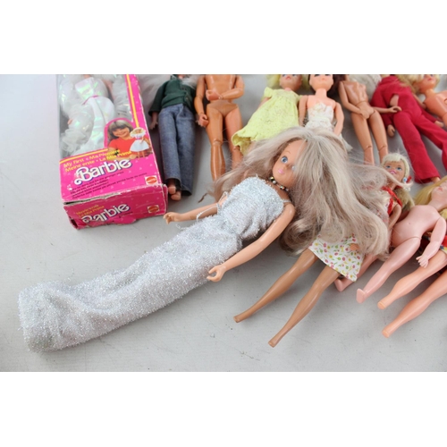 82 - A collection of assorted dolls to include Barbie, Bionic Woman, Tressy, Clones etc.