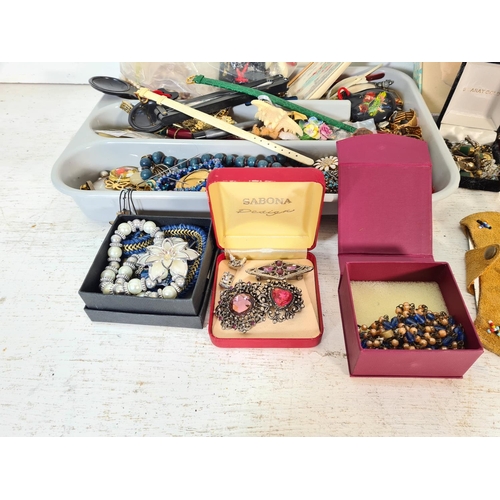 110 - A large collection of assorted costume jewellery and women's wristwatches to include rings, necklace... 