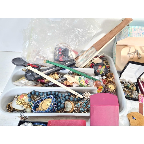 110 - A large collection of assorted costume jewellery and women's wristwatches to include rings, necklace... 