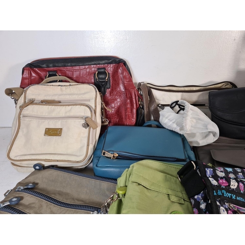 129 - A collection of assorted women's bags to include Kipling, Nathalie Andersen, Fantasy etc.