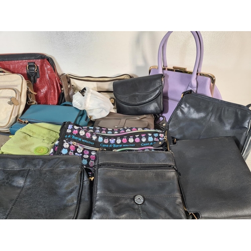 129 - A collection of assorted women's bags to include Kipling, Nathalie Andersen, Fantasy etc.