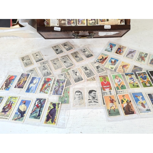 135 - A large collection of assorted vintage postcards, First Day covers and collectors cards