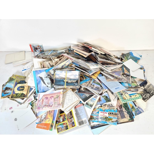 141 - A large collection of antique and vintage postcards