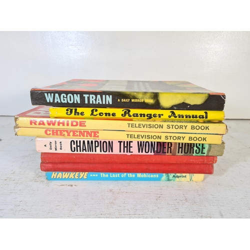 143 - Eight assorted vintage Western hardback books to include Wagon Train, The Lone Ranger annual, Rawhid... 