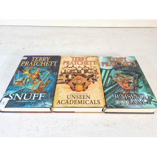 144 - Three Terry Pratchett 1st edition hardback books