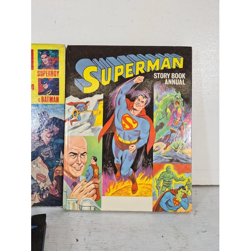 145 - Four assorted vintage annuals, two 1960s Superman, one 2000AD and one Captain Scarlett