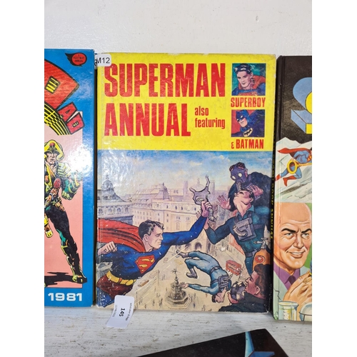 145 - Four assorted vintage annuals, two 1960s Superman, one 2000AD and one Captain Scarlett