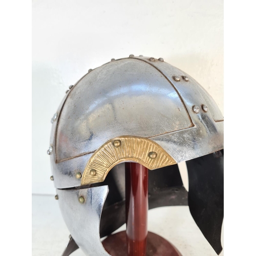 166 - A Battle Re-enactment Knight's helmet on wooden stand - approx. 37cm high on stand