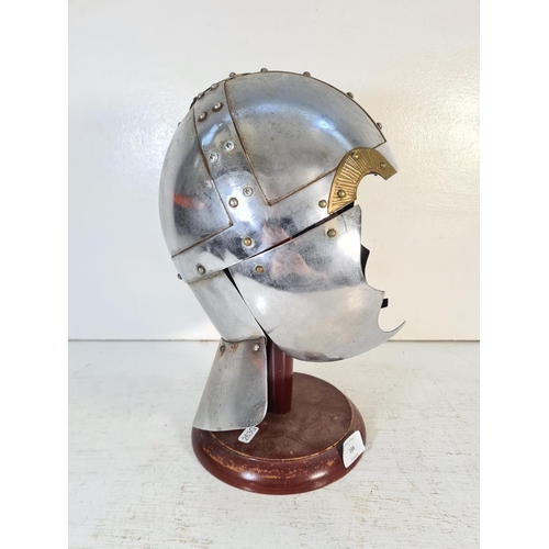 166 - A Battle Re-enactment Knight's helmet on wooden stand - approx. 37cm high on stand