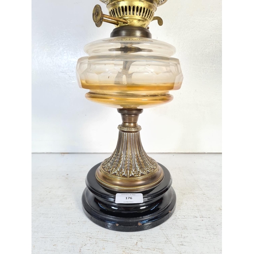 176 - A 19th century Eltex brass oil lamp with glass reservoir - approx. 58cm high