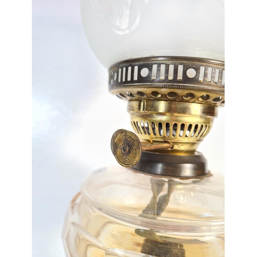 176 - A 19th century Eltex brass oil lamp with glass reservoir - approx. 58cm high