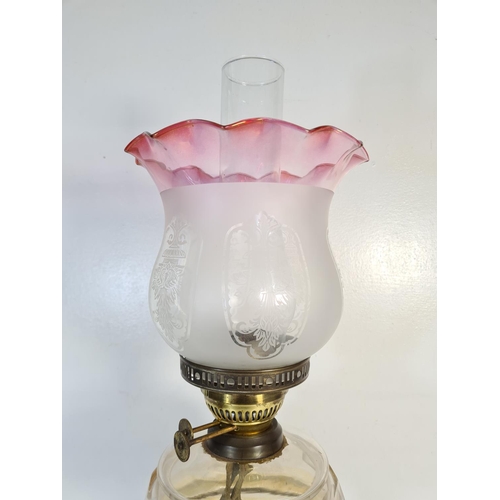 176 - A 19th century Eltex brass oil lamp with glass reservoir - approx. 58cm high